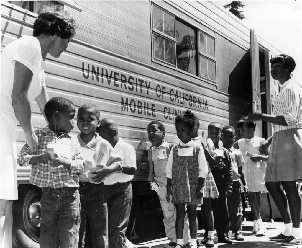 Children in line in front of the Mobile Dental clinic, 1966