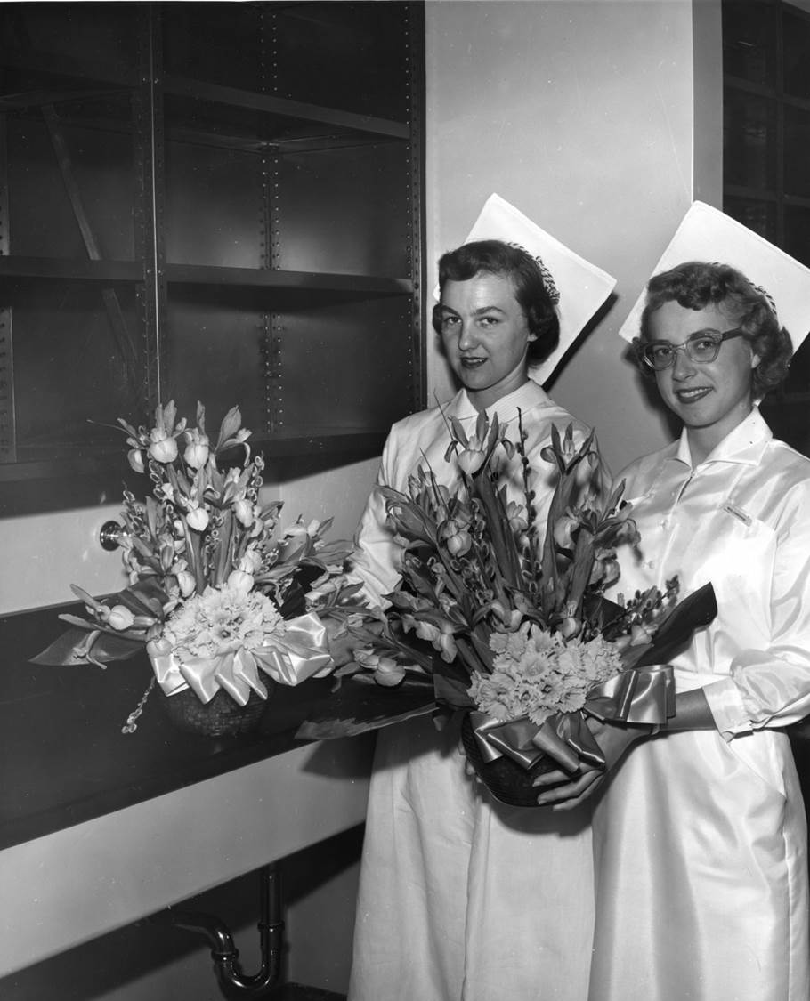 Moffitt-two-nurses-w-flower