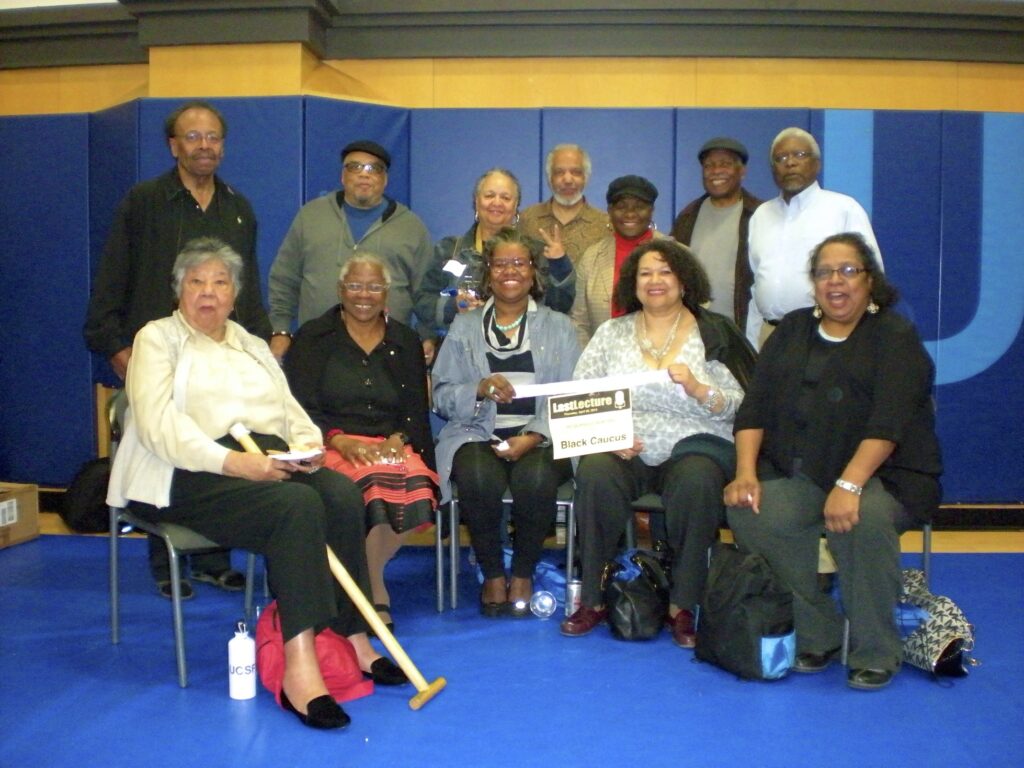 Group photograph of the founding members of the UCSF Black Caucus in December 2013 taken at the Millberry Union following Dr. Daniel Lowenstein’s “Last Lecture Series” at Cole Hall. Standing, left to right, are Bill Stevens, Joseph Lambert, Elba Clemente-Lambert, Michael Adams, Norma Faris Taylor, Dr. John Watson, and Charles Clarey. Sitting, left to right, are Joanne Lewis, Carol Yates, Ethel Adams, Crystal Morris, Karen Newhouse.